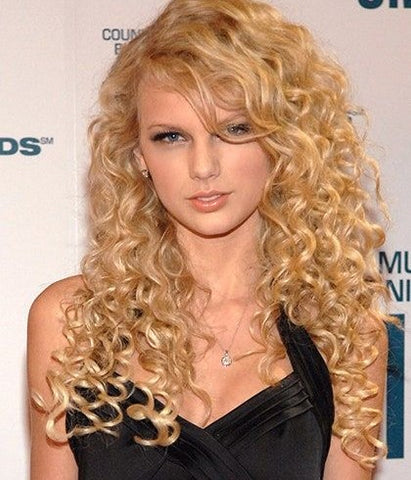 Taylor Swift with long golden curly hair during her early country music era