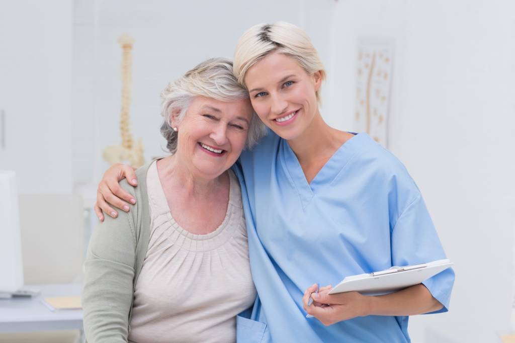 Roop Cottage care professional reviewing a resident's plan with her