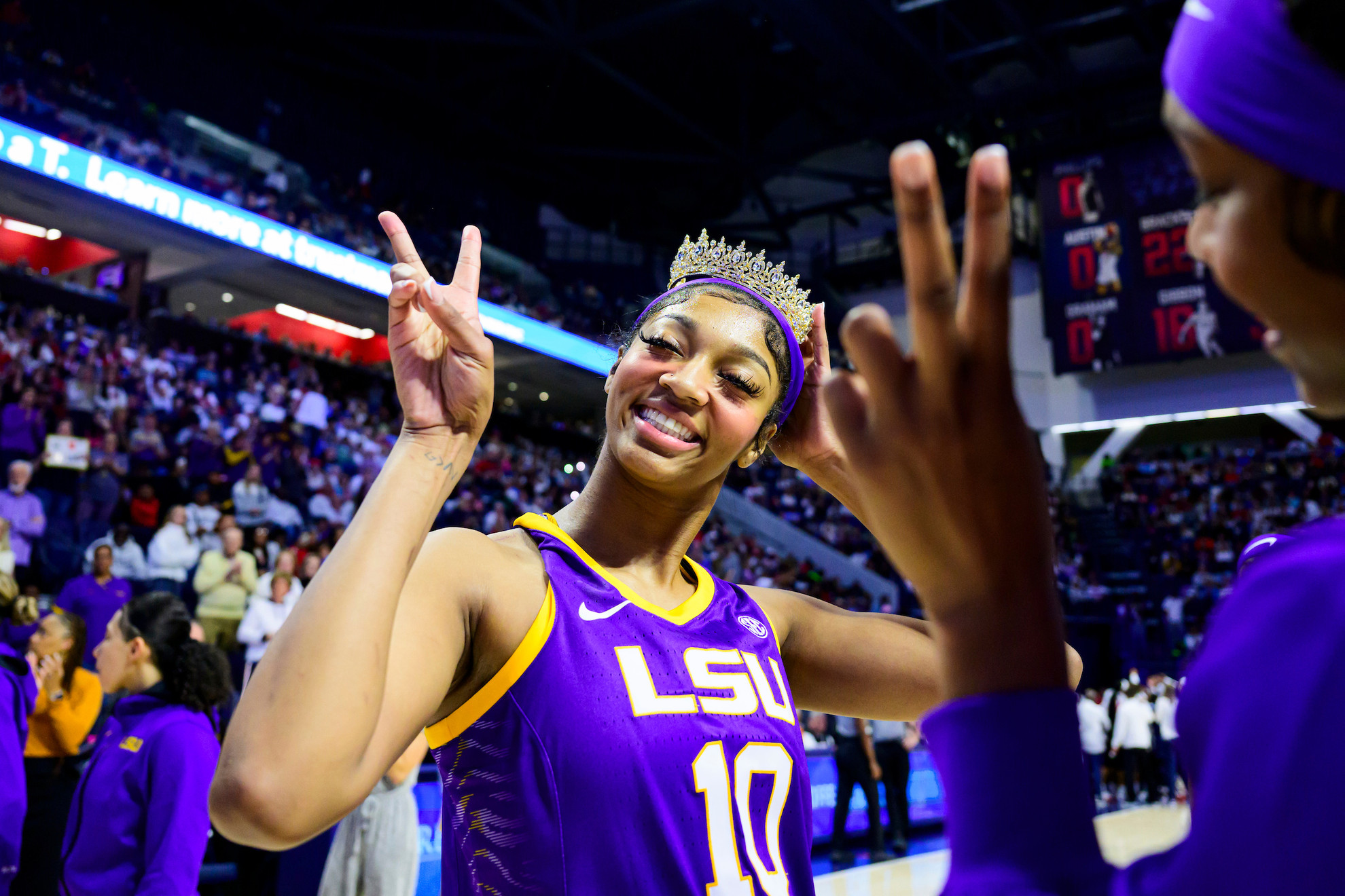 Angel Reese celebrates in her LSU Tigers jersey after winning the 2023 NCAA national championship