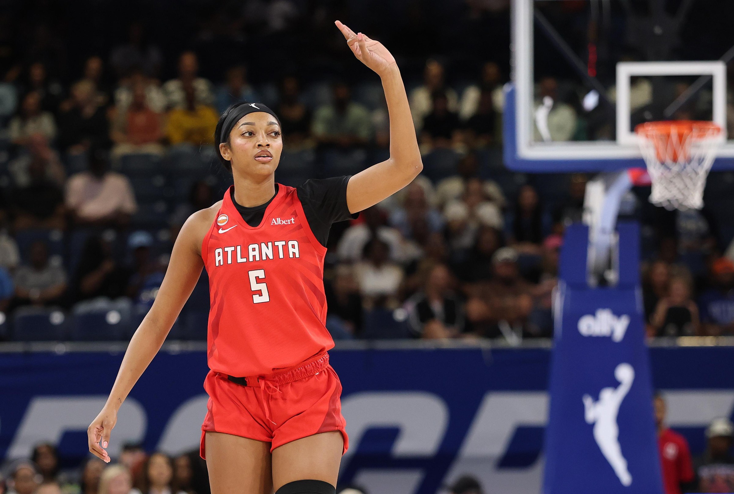 Angel Reese waves to the crowd in her Atlanta Dream jersey during the 2026 WNBA season