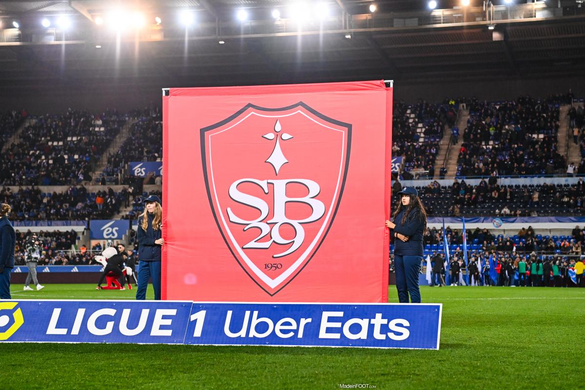 Stade Brestois 29's red and white crest displayed on a large banner before a Ligue 1 match