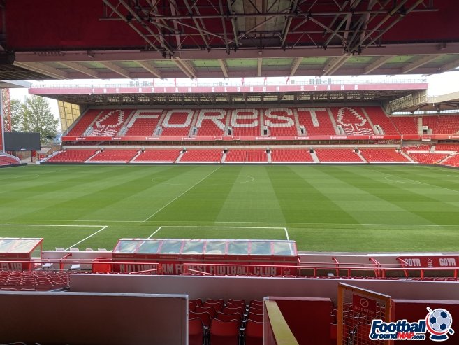 The word FOREST spelled out in white seats across the red stand at Nottingham Forest's City Ground