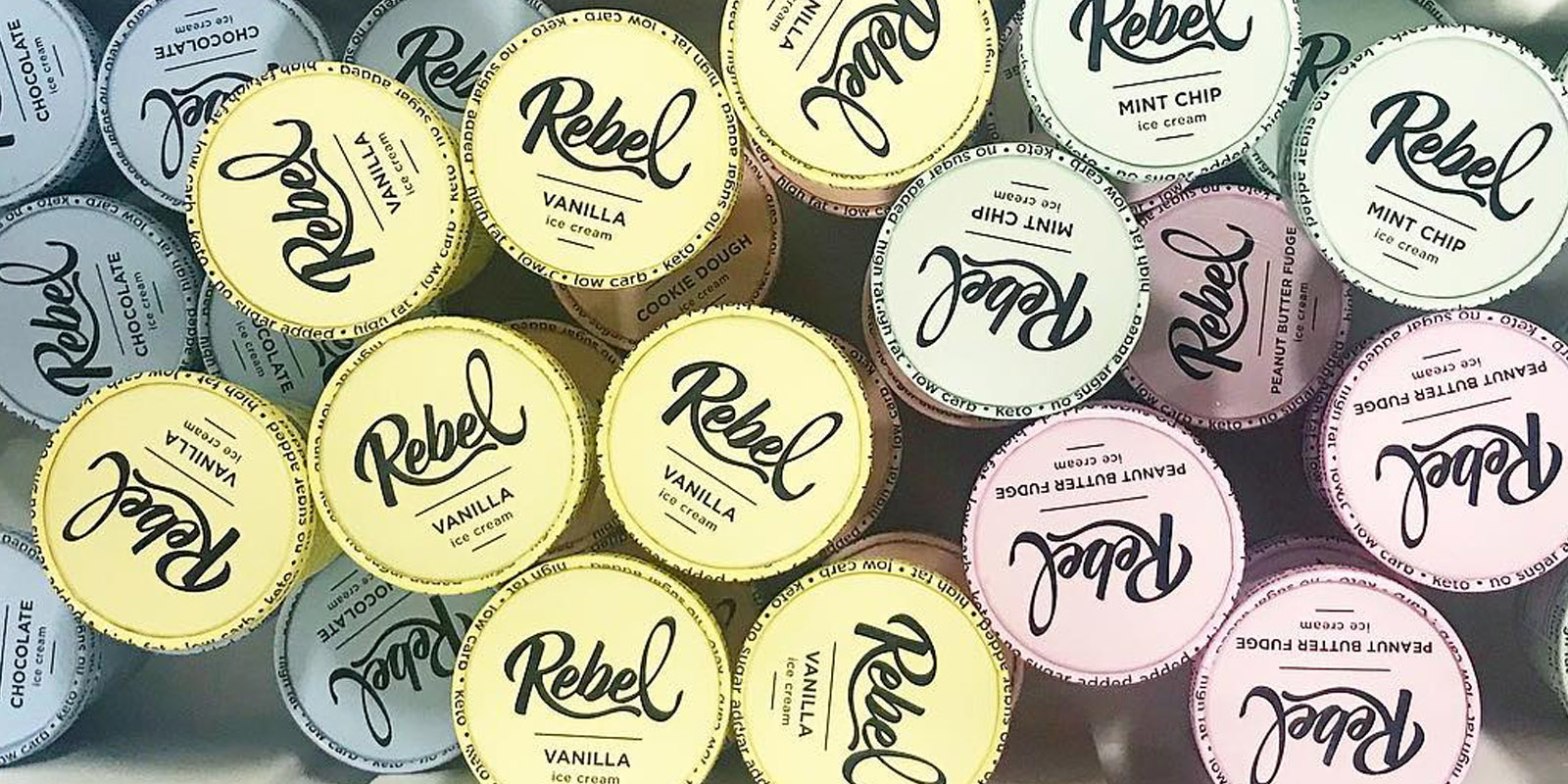 Overhead view of pastel Rebel Creamery pint lids whose look-alike design sits at the center of the Rebel Creamery ice cream lawsuit