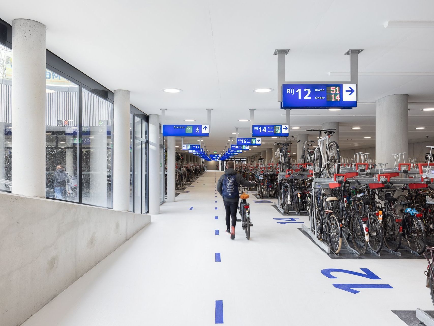 A covered, supervised indoor bicycle parking hall in the Netherlands, one of the safest places to leave an e-bike and cut theft risk
