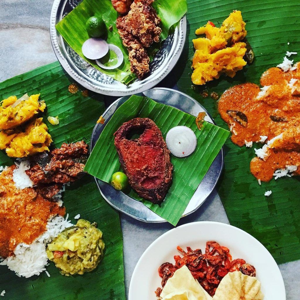 Banana leaf feast with fried fish