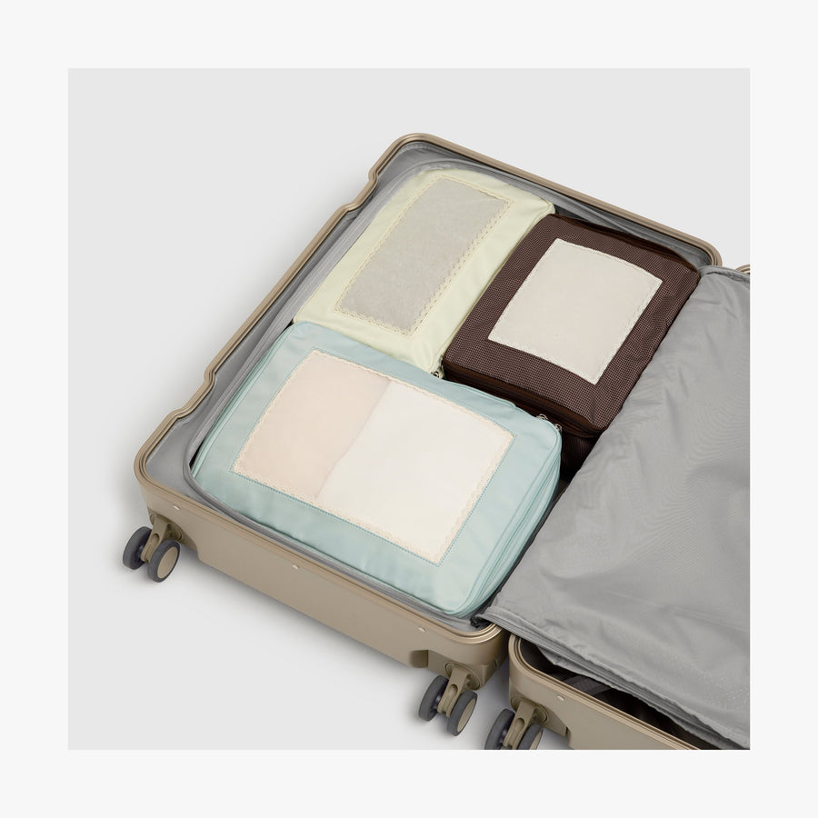 Compression packing cubes fitted inside a carry-on suitcase