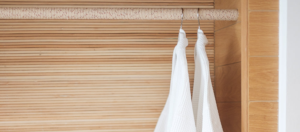 Light shirts hanging on a closet rail