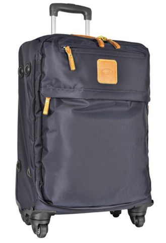A compact navy softside carry-on suitcase ready to roll