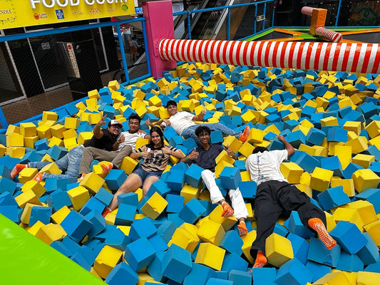 Group relaxing in the foam pit