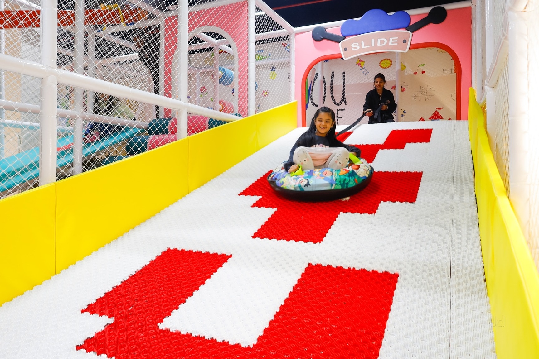 Child sliding down the speed slide