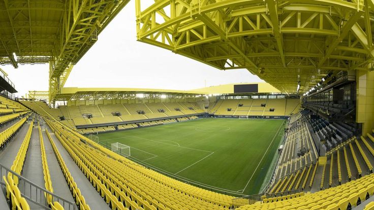 The yellow seating and roof structure of Villarreal's Estadio de la Cerámica