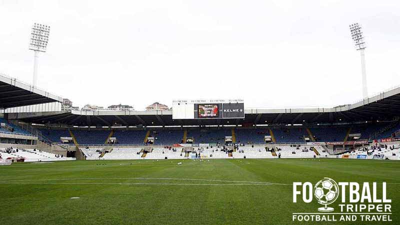 Inside the Campos de Sport de El Sardinero before a Racing Santander match, showing the pitch and main stand