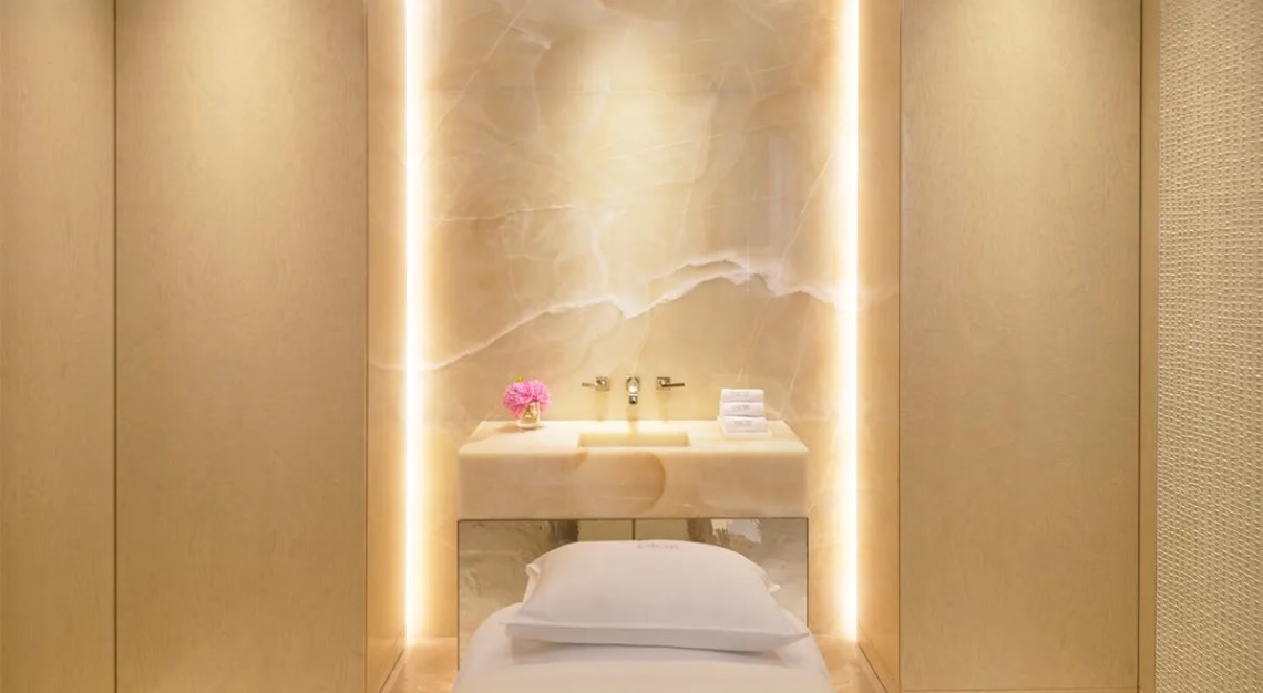 Serene med spa treatment room in warm champagne light