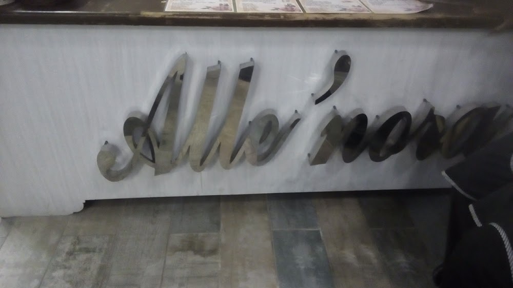 Alle'nora salon signage in polished steel script