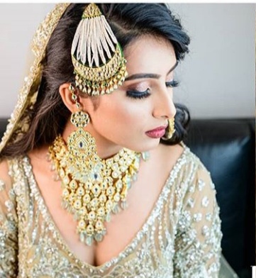 Bride profile with gold jhoomar and necklace