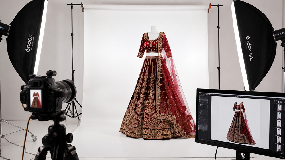 In-house bridal photography studio — lehenga on set with camera and monitor